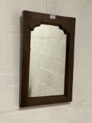 An 18th century and later wall hanging mirror in a pegged and jointed oak frame. 38cm x 57cm.