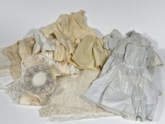 A collection of 19thc dolls hand made clothing including, a muslin lace fronted dress, and a similar