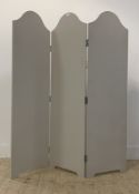 A traditional style tri-fold room divider, with three arched panels finished in matt grey paint, and