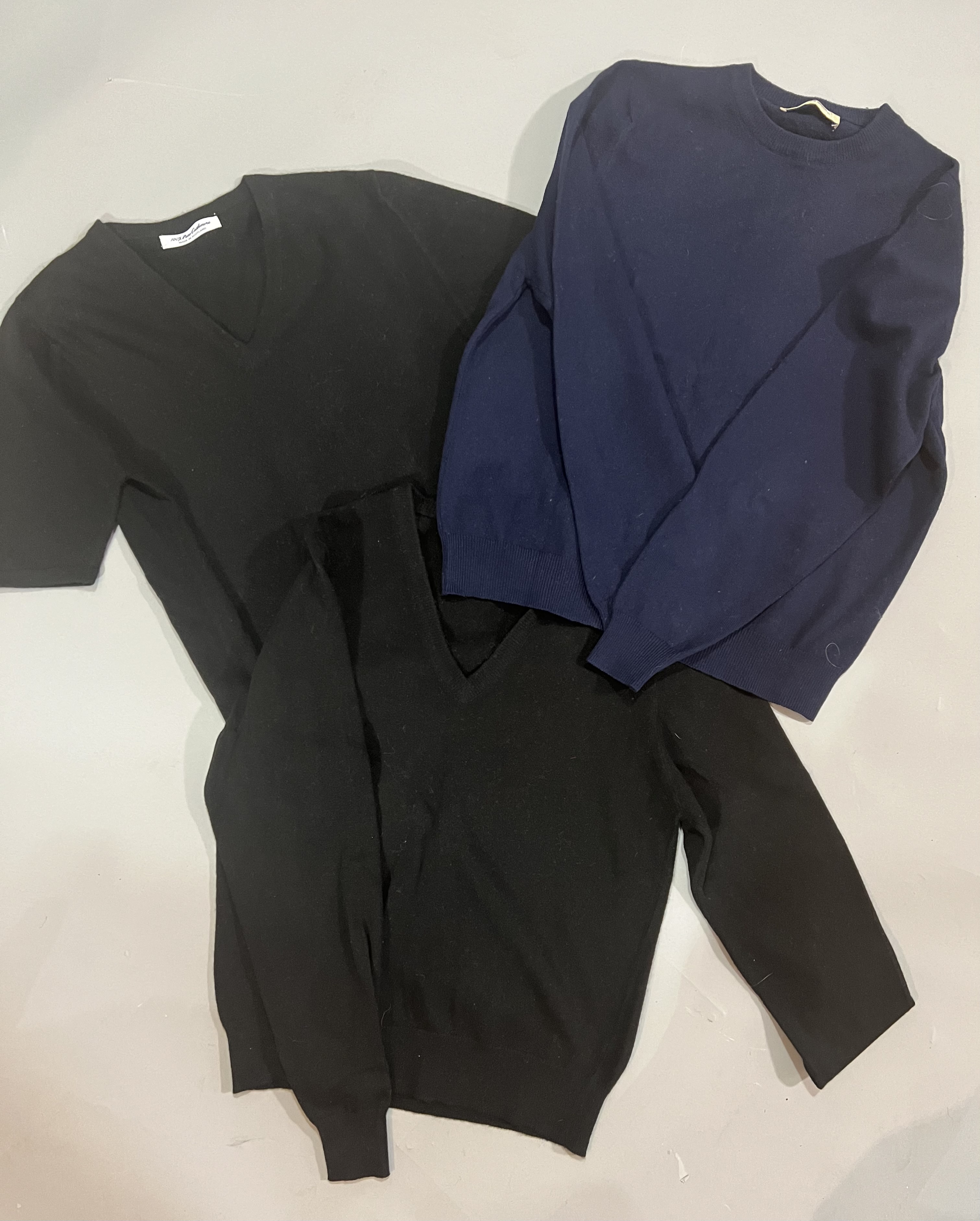 A group of black and navy cashmere and wool knitwear
