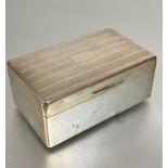 A Birmingham silver rectangular cigarette box with engine turned top with cedar lined interior, (