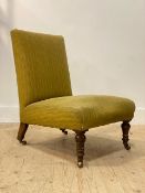 A mid Victorian walnut framed bedroom chair, the seat and back upholstered in green chenille, raised