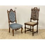 A Victorian carved oak side chair of Carolean design, with spiral turned pilasters and supports (