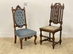 A Victorian carved oak side chair of Carolean design, with spiral turned pilasters and supports (