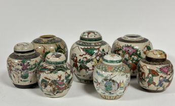 A collection of six various Japanese ginger jars decorated with Samurai fighting scenes, two missing