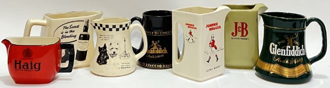 A mixed group of Whisky advertising ceramic water jugs comprising Johnnie Walker Scotch Whisky,