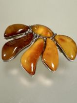 A  continental 925 standard amber panel brooch in the Art Nouveau style, with beaded fronds with