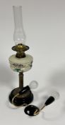 An Edwardian brass fluted column oil lamp with glass well with hand painted floral design complete
