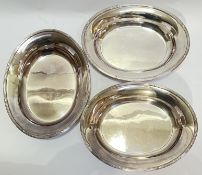 A set of three Elkington Plate oval serving dishes/bowls with reed and tie border modelled as