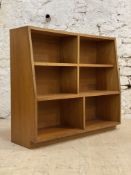 A mid century teak floor standing open waterfall bookcase, fitted with a combination of fixed