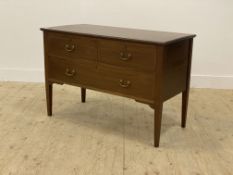 An Edwardian inlaid mahogany wash stand, fitted with two short and three long drawers, raised on