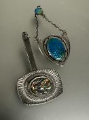 A Edwardian Chester Art Nouveau silver enamel pendant of oval shaped design within a shield shaped