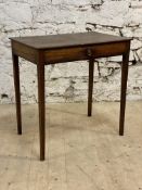 A George III mahogany side table, the square top above a frieze drawer, raised on square tapered