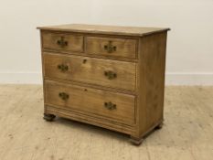 A late 19th century elm chest, fitted with two short and three long drawers, raised on shaped