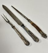 An Edwardian Epns kings pattern steel bladed carving knife and fork set by Carrington of London