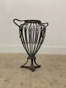 A wrought metal brazier of urn form, with twin handles and standing on triple splay supports H50cm.