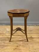 An Edwardian walnut sewing table, the octagonal top with inlaid paterae to centre and bordered