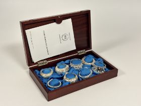 A cased set of eight Omani white metal napkin rings,