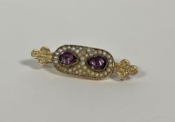 A late Victorian amethyst and seed pearl brooch