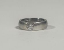 A gypsy-set diamond solitaire ring