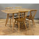 Ercol, A vintage dining suite, circa 1970's / 80's, comprising a dining table with shaped elm top