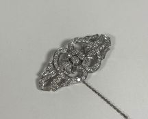 A diamond brooch in the Art Deco taste, of shaped lozenge form