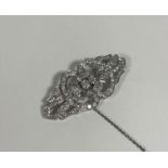A diamond brooch in the Art Deco taste, of shaped lozenge form