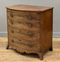 A small, well proportioned George III mahogany bow front chest, late 18th century, the boxwood