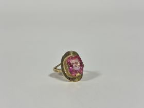 A single stone pink spinel dress ring