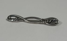 Georg Jensen, a Danish sterling silver bar brooch, c. 1933-44, modelled with leaves and berries