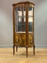 A mahogany vitrine display cabinet of serpentine outline in the French taste, early 20th century,