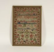 A mid-19th century needlework sampler, worked in coloured threads with bands of alphabet, birds and