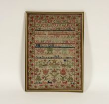 A mid-19th century needlework sampler, worked in coloured threads with bands of alphabet, birds and