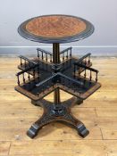 An Aesthetic Period amboyna and ebonised book table, circa 1870's, the circular top with incised