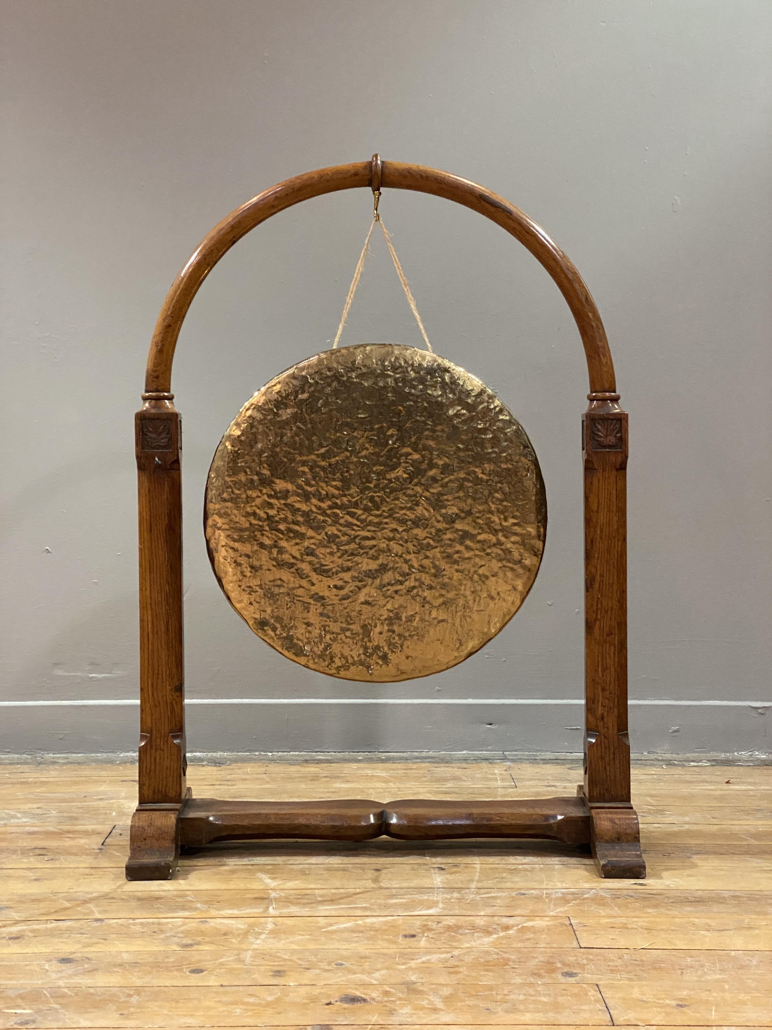 A Victorian floor standing dinner gong, the hammered brass gong hanging from an oak frame with - Image 2 of 2
