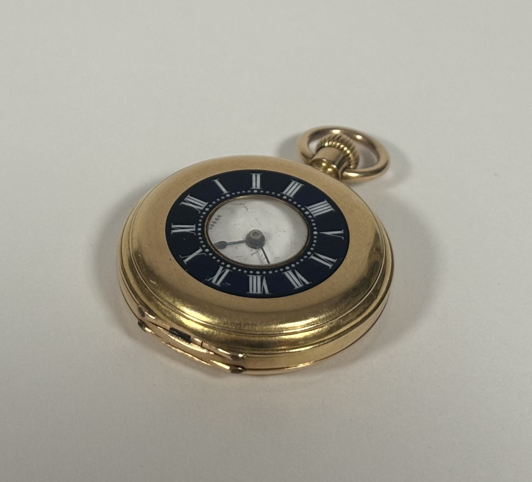 An 18ct gold and enamel small half-hunter fob watch, late 19th century