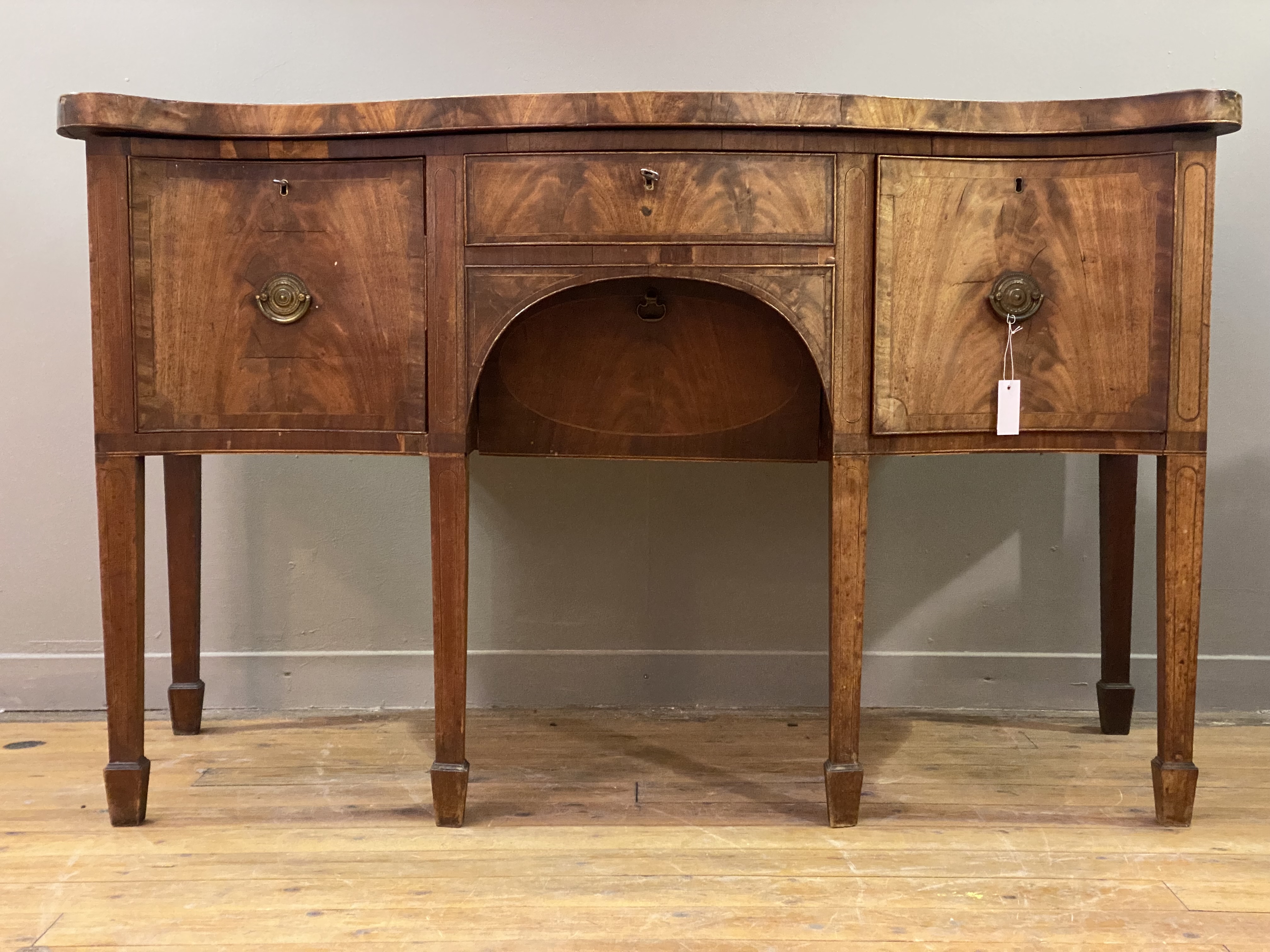 A George III mahogany serving table of deep and squat proportions, late 18th century, the