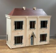 A large white painted pine scratch built dolls house, early 20th century, the lift off roof above