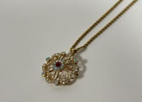 An Edwardian 9ct gold, opal and seed pearl brooch/pendant