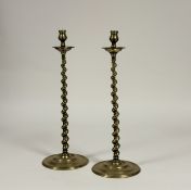 A pair of tall brass barley twist altar or candlesticks, late 19th century