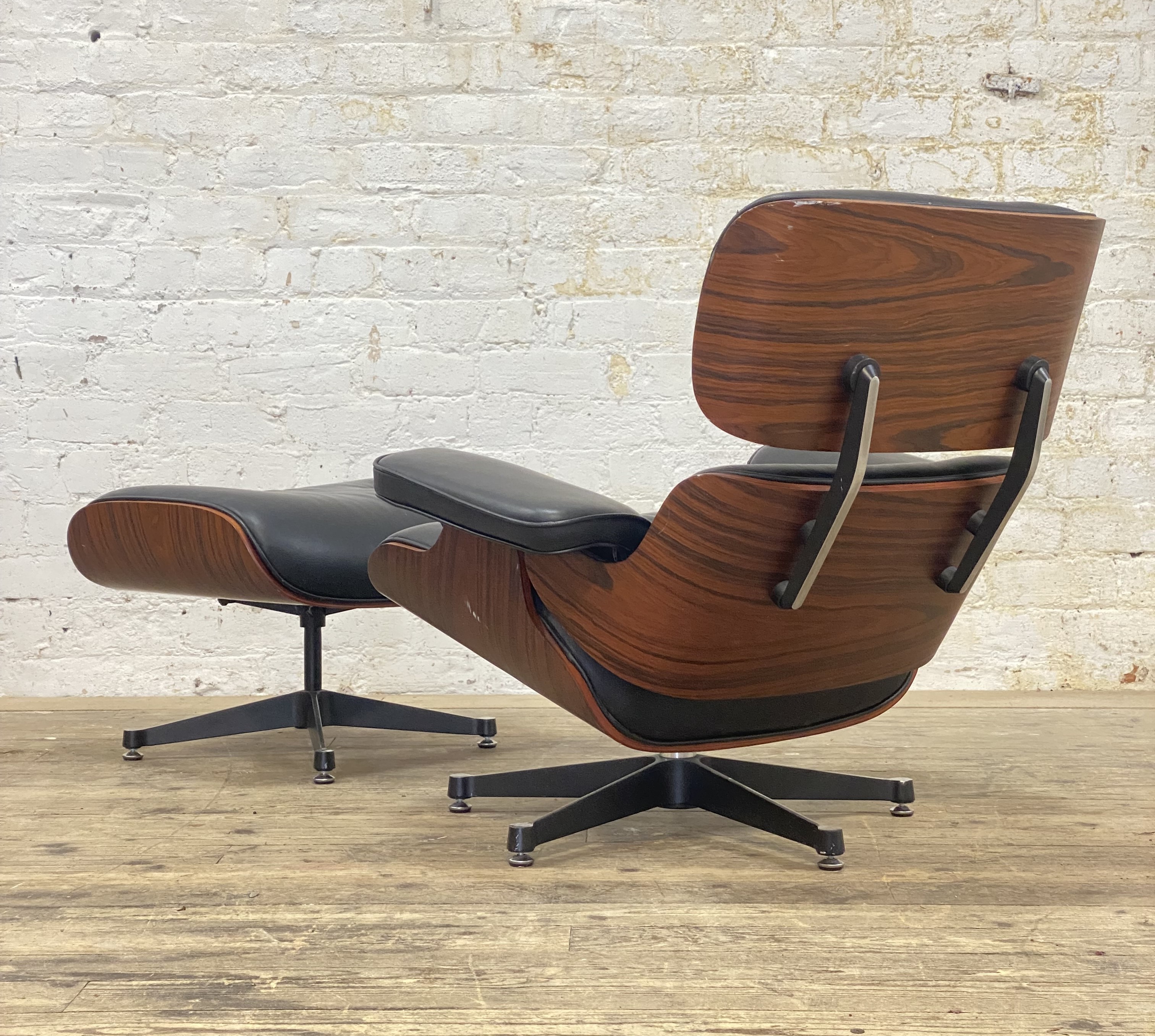 After Charles and Ray Eames, a lounge chair and ottoman.
