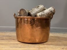 A 19th century copper log bin with riveted loop handle to each side, complete with silver birch