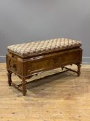 A Victorian walnut duet stool, the needlework upholstered seat worked in a geometric and floral