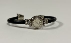 Rolex: a lady's diamond-set 18ct white gold "Precision" cocktail watch, c. 1950