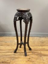 A Chinese rosewood jardinière stand, late Qing dynasty, the top, of scalloped form, with beaded