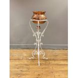 A late 19th / early 20th century copper and white painted wrought iron jardinière and stand, the