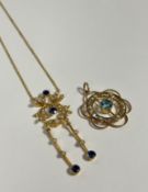 An Edwardian 15ct gold, sapphire and seed pearl pendant