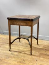 An Edwardian rosewood envelope top card table, with four boxwood strung and marquetry panels opening