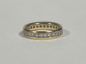 An 18ct gold full hoop diamond eternity ring