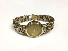 14ct gold Geneve Quartz wristwatch on white and yellow gold bracelet